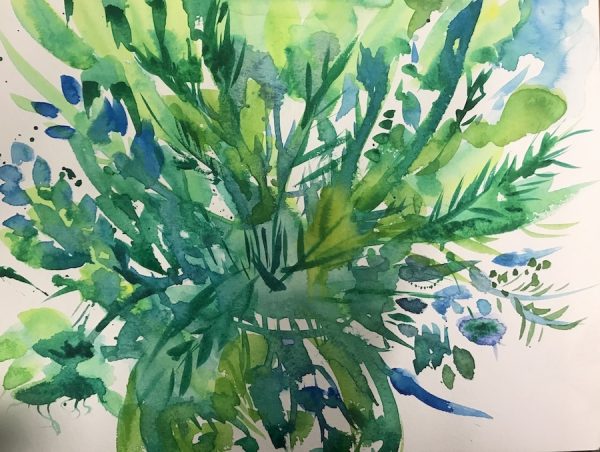 Green and blue vase of flowers