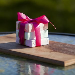 Stack of mini soaps in a gift bow
