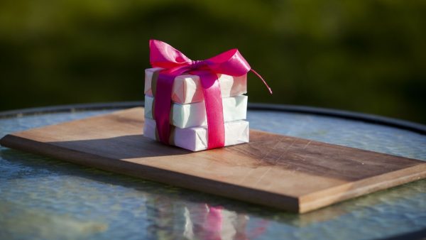 Stack of mini soaps in a gift bow
