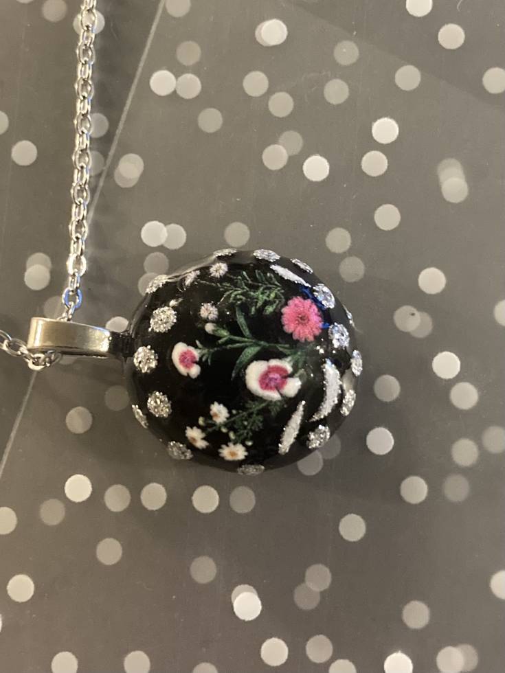 Handmade floral glass necklace.