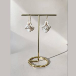 Handmade pearlescent white polymer clay petal earrings with elegant pearl drops.